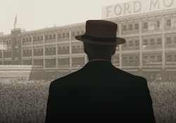 A silhouette of the late Henry Ford looks on toward the "Ford Motor Company" factory