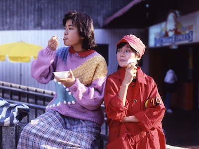 Two women eating ice cream.