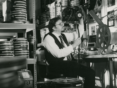 Robert Rosen looking at a film strip.