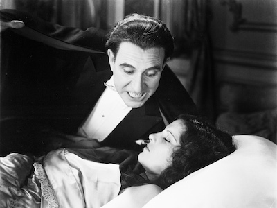 Dracula approaching a sleeping woman.