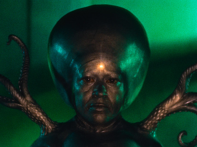 A human-like alien with a large head.