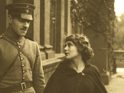 Mary Pickford looking at a man in military uniform.