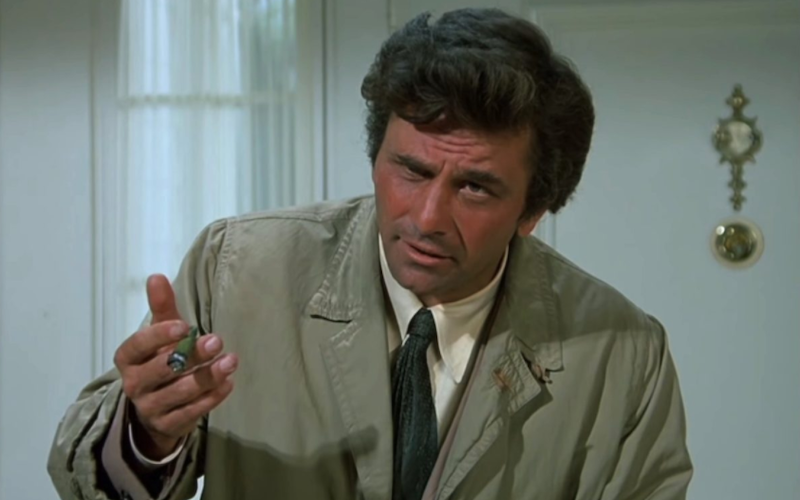 Peter Falk holding a cigar.