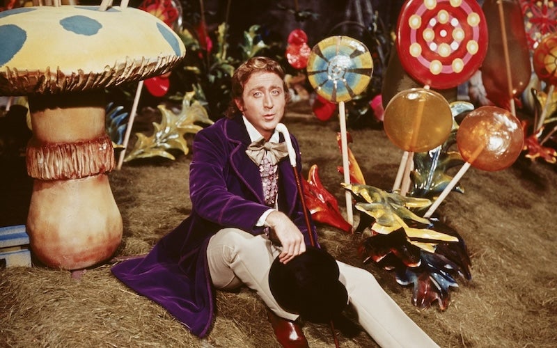 Willy Wonka among oversized candies and mushrooms.