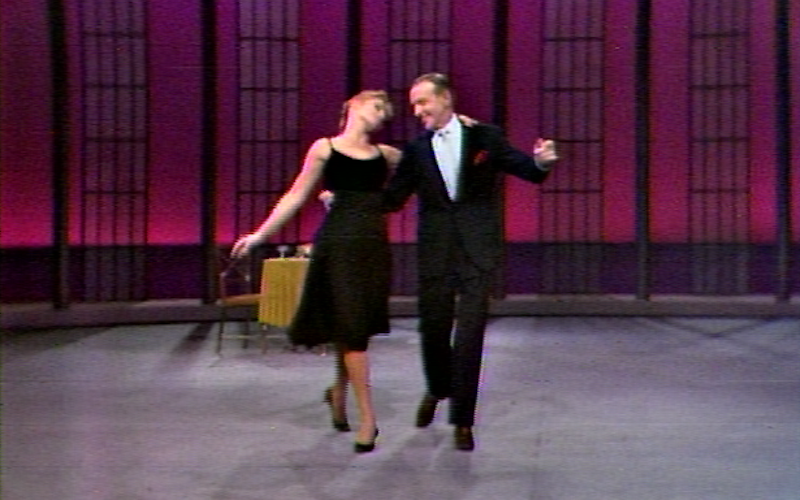 Barrie Chase and Fred Astaire dancing in a TV studio.