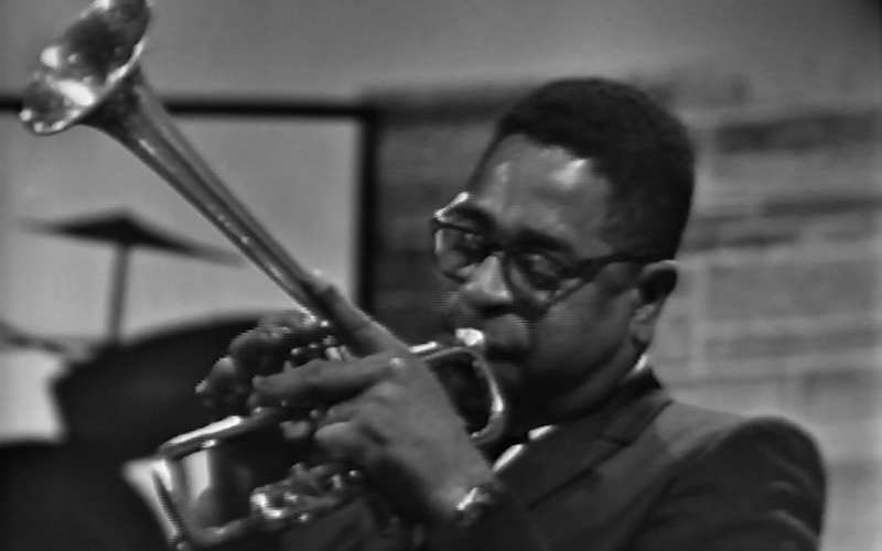 Dizzy Gillespie playing trumpet.