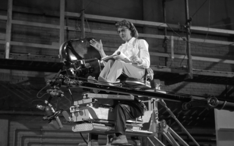 Ida Lupino in a director's chair next to a camera