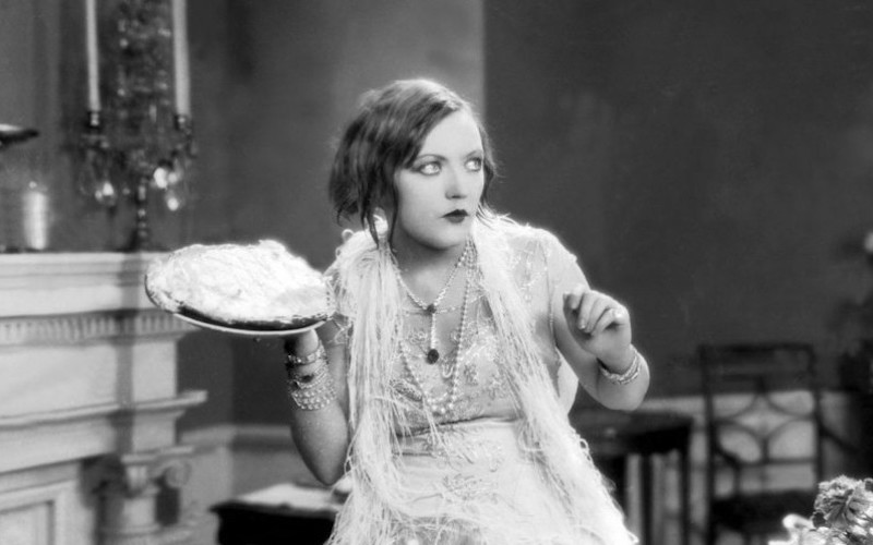 Actor Marion Davies getting ready to throw a pie.