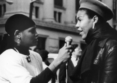 A person being interviewed on the street.