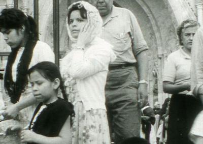 A group of people outside a church.