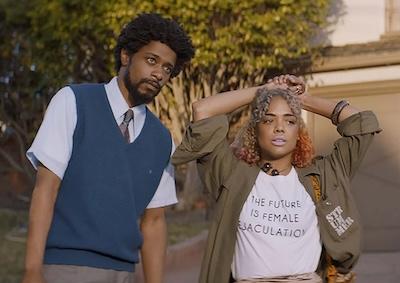 Actors LaKeith Stanfield and Tessa Thompson standing in front of a house. 