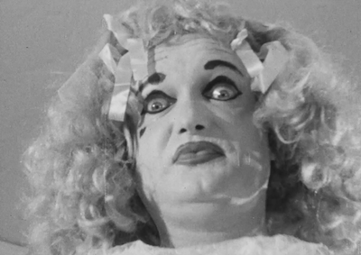 A person impersonating Bette Davis in "What Ever Happened to Baby Jane?"