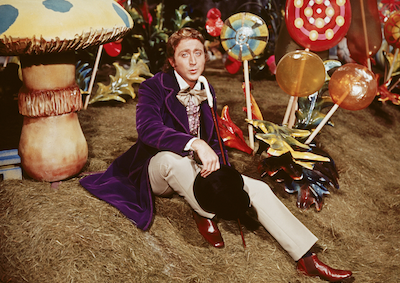 Willy Wonka among oversized candies and mushrooms.
