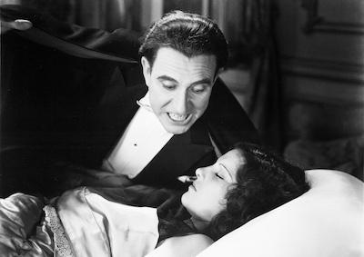 Dracula approaching a sleeping woman.