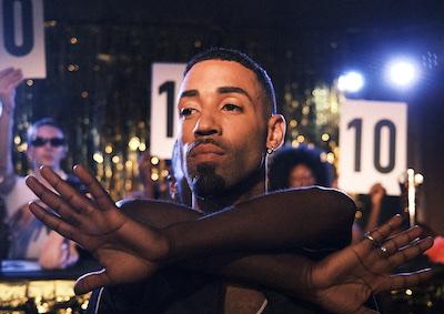 A person voguing in a ball.