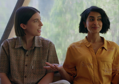 Two women sitting by a window.