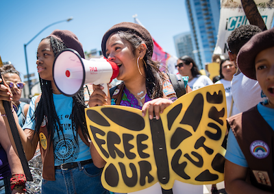 A group of girls participating in a protest.