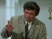 Peter Falk holding up a cigar.