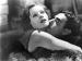 Greta Garbo and John Gilbert embracing.