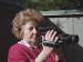 A woman holding a video camera.