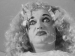 A person impersonating Bette Davis in "What Ever Happened to Baby Jane?"